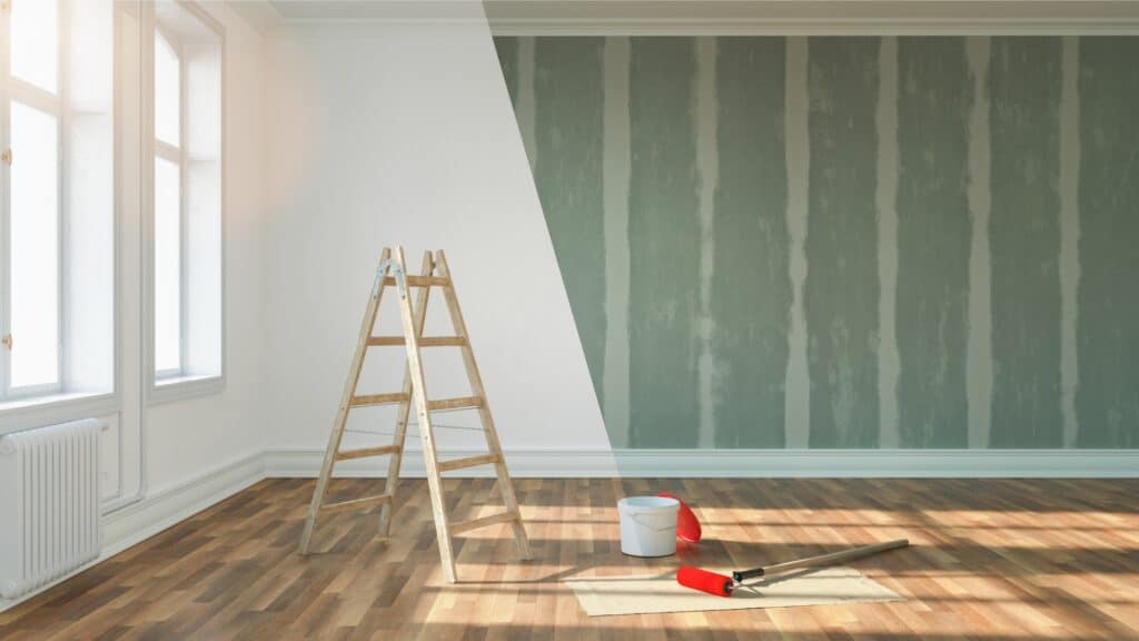 Una habitación con pintura y una escalera disponible para su uso.